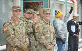 Soldiers in Army Combat Uniform watching Leavenworth County Veterans Day Parade