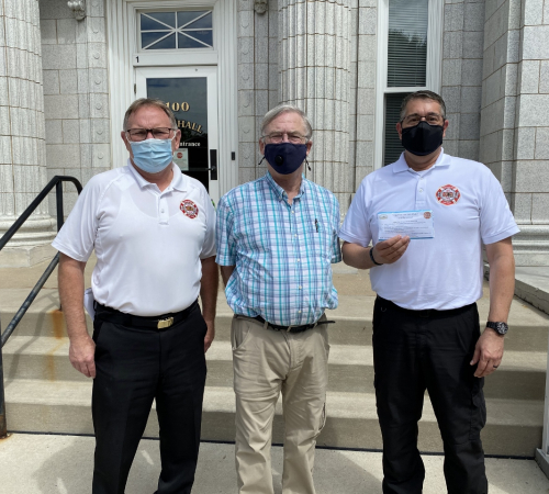 Fire department and city mayor with face masks