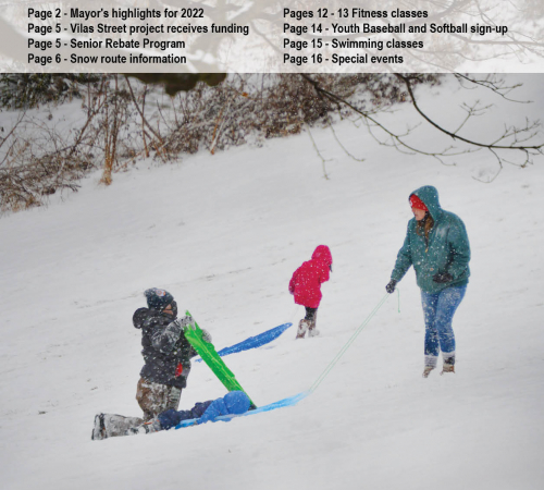 photo of First City Connection magazine cover with children carrying sleds up a snowy slope