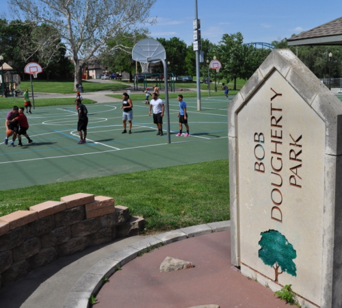 Bob Dougherty Park sign and basketball court