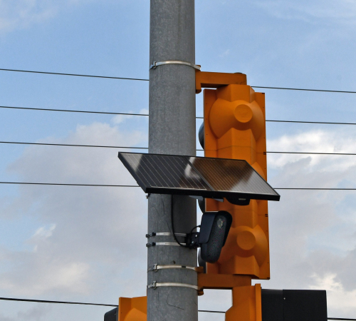Photo shows a black panel mounted to a traffic safety light
