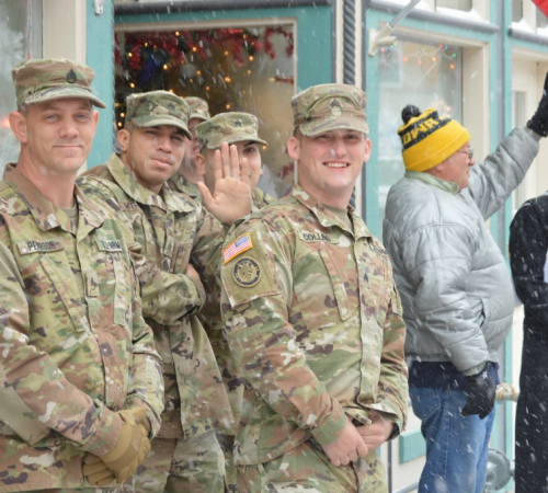 Soldiers in Army Combat Uniform watching Leavenworth County Veterans Day Parade