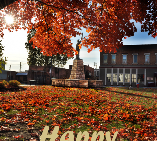 Photo of a fall tree near City Hall with the text Happy Thanksgiving and City logo