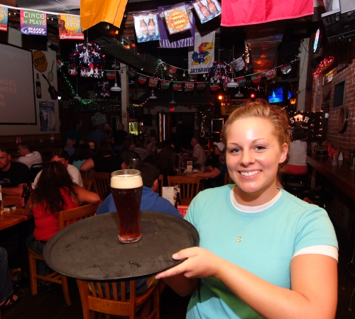 Lady serving a beer