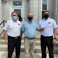 Fire department and city mayor with face masks