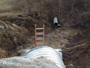 637 McDonald ladder leaning on broken drainage tube