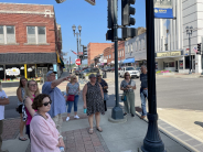 Leavenworth Main Street and City officials tour downtown with historic preservation expert.