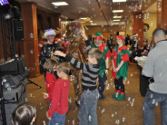 Bubbles surround kids at Breakfast with Santa