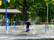 child running in splash pad