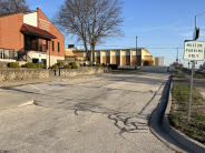 Parking lot at Richard Allen Cultural Center shows cracks and unevennesss