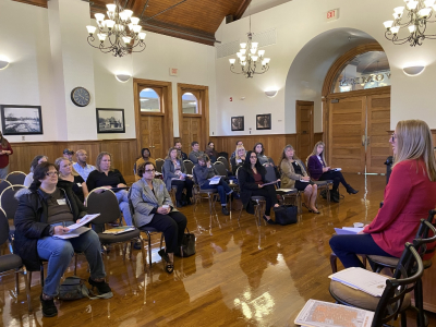 Penny Holler Assistant City Manager speaking to a crowd of business professionals at the Riverfront Community Center Oct. 17 