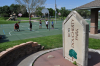 Bob Dougherty Park sign and basketball court